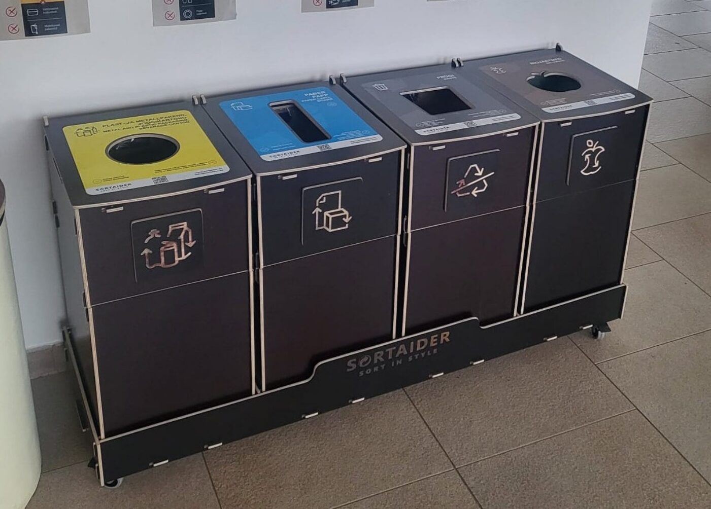 Sortaider multi-compartment recycling bins installed at office for plastic, paper, packaging, and general waste.