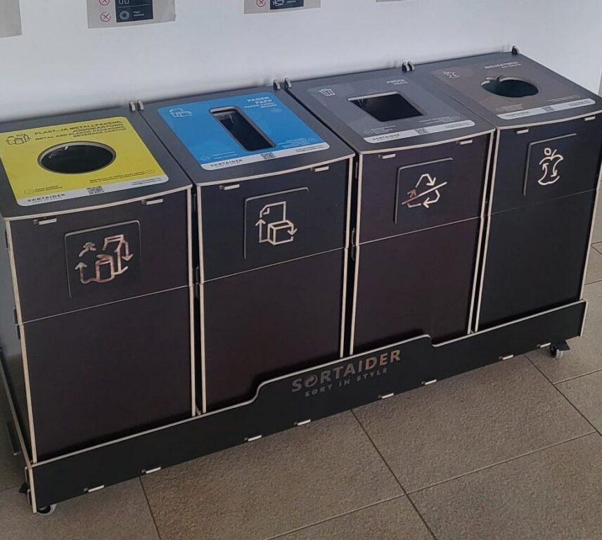 Sortaider multi-compartment recycling bins installed at office for plastic, paper, packaging, and general waste.