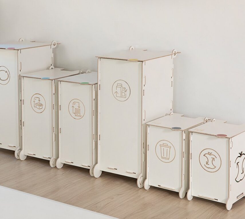 White clinical waste bins with symbols for paper, packaging, mixed, and bio waste, designed for healthcare facilities and laboratories.