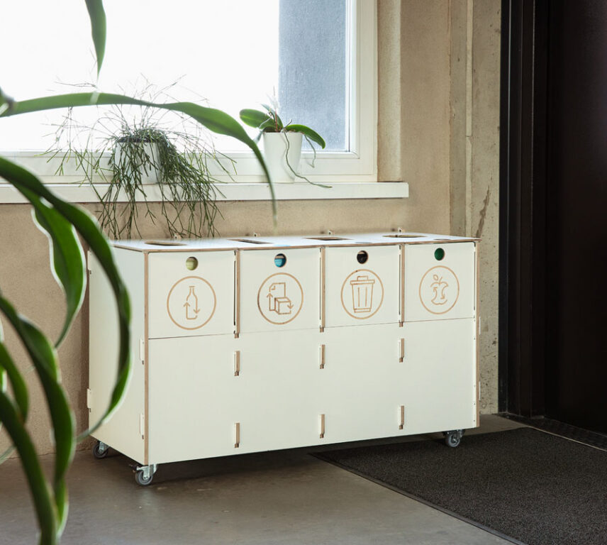 Modern office interior featuring recycling bins for paper, plastic, mixed waste, and biowaste, installed at Estonian Traffic Insurance Fund – Sortaider.