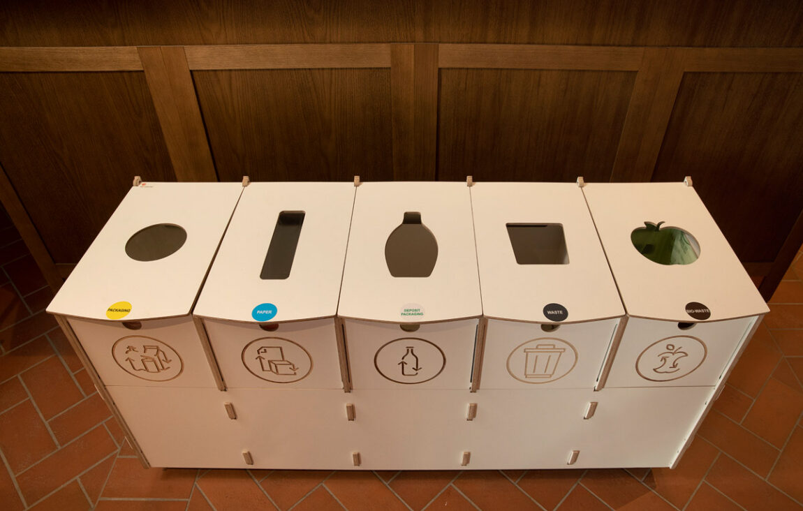 Recycling bins for employee areas placed in a staff space to support everyday recycling habits.