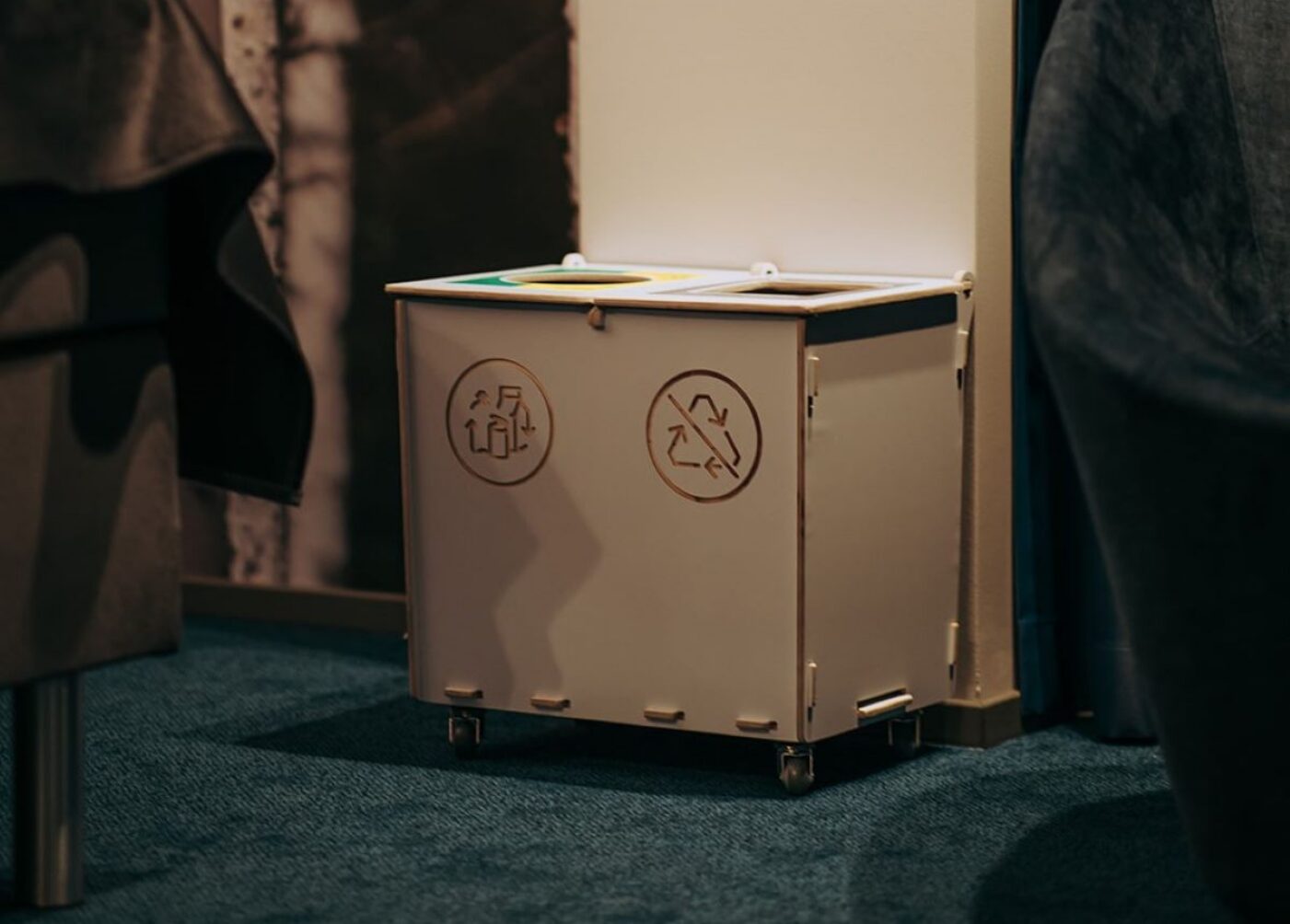 Recycling bins for hotels placed discreetly to support casual waste sorting.