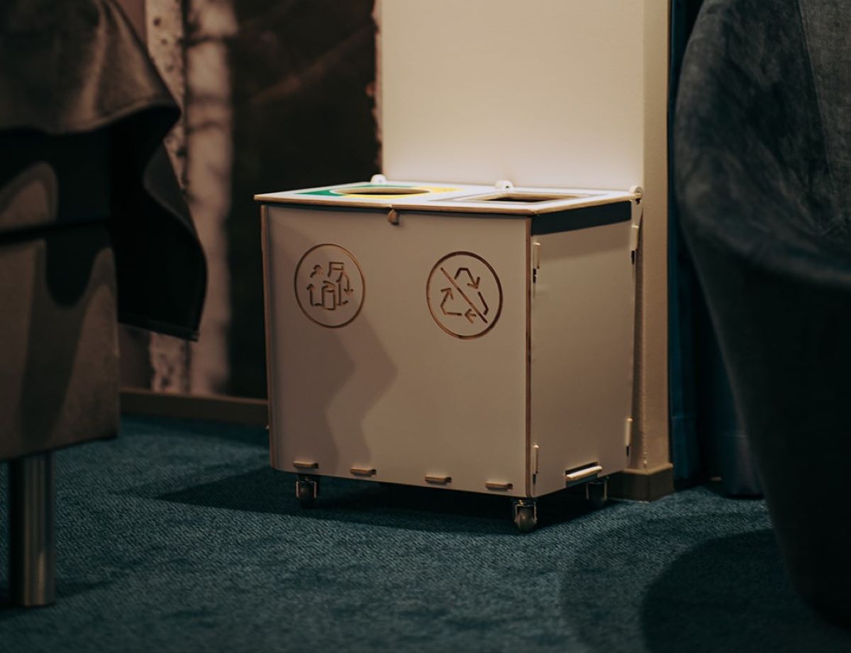 Recycling bins for hotels placed discreetly to support casual waste sorting.