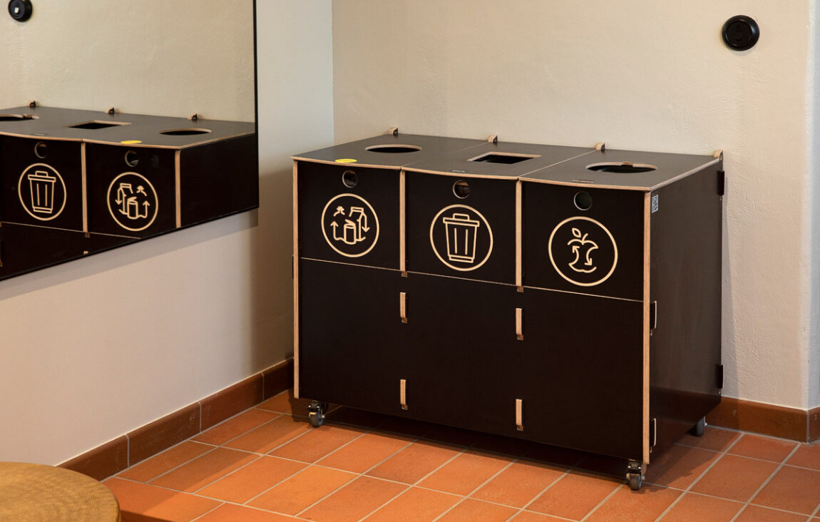 Recycling bins for schools placed in a school corridor to support everyday waste sorting habits.