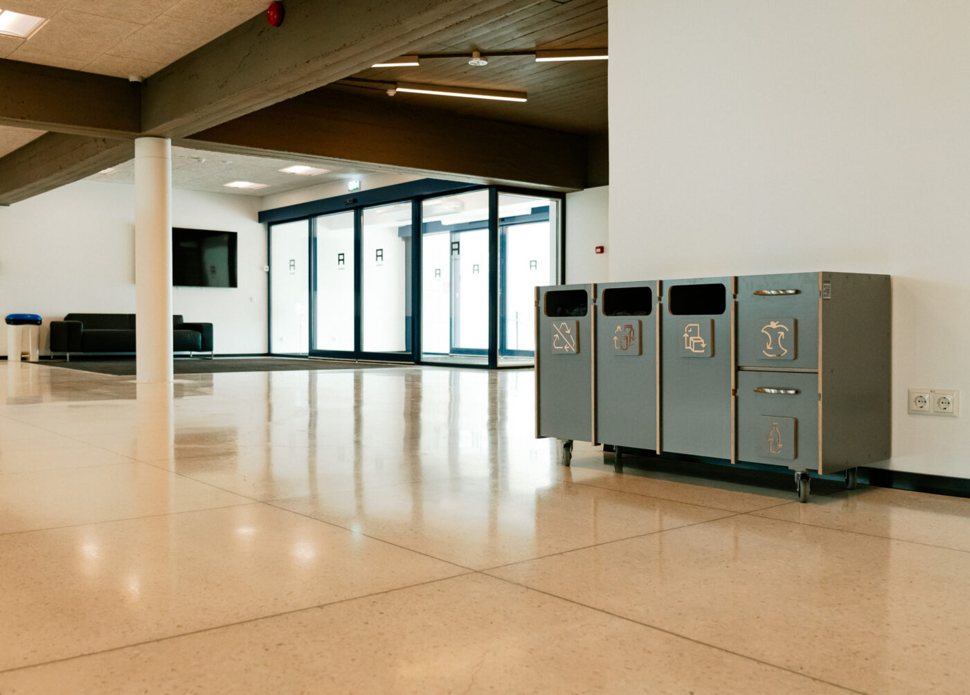 Recycling bins used for educational purposes to explain waste sorting.