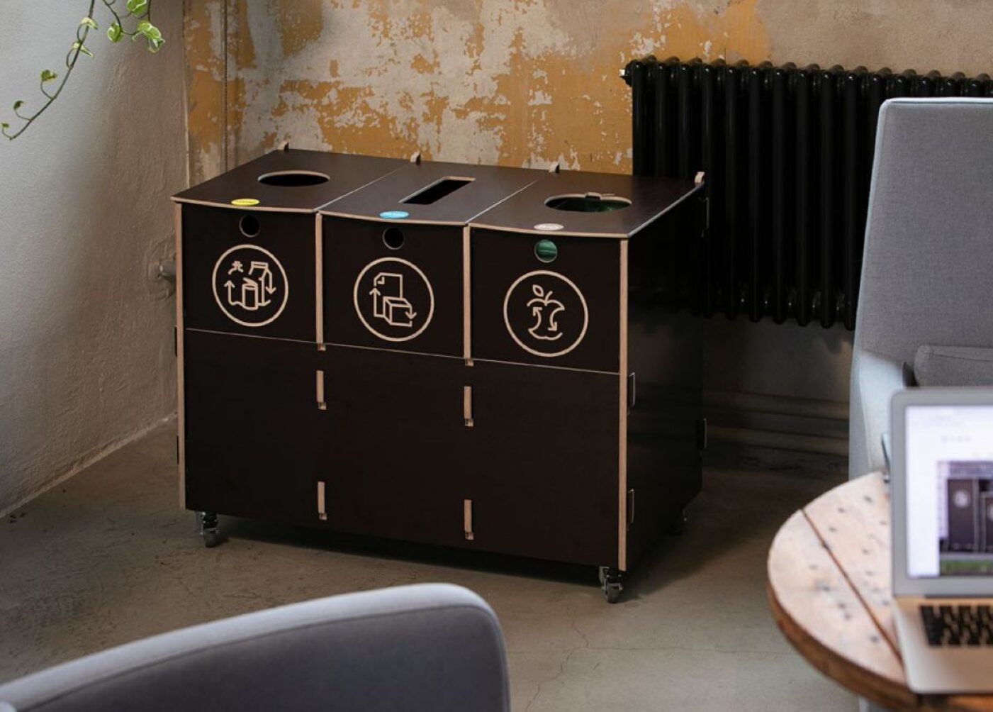 Recycling bins with lids in use, showing a clean and contained waste sorting setup.