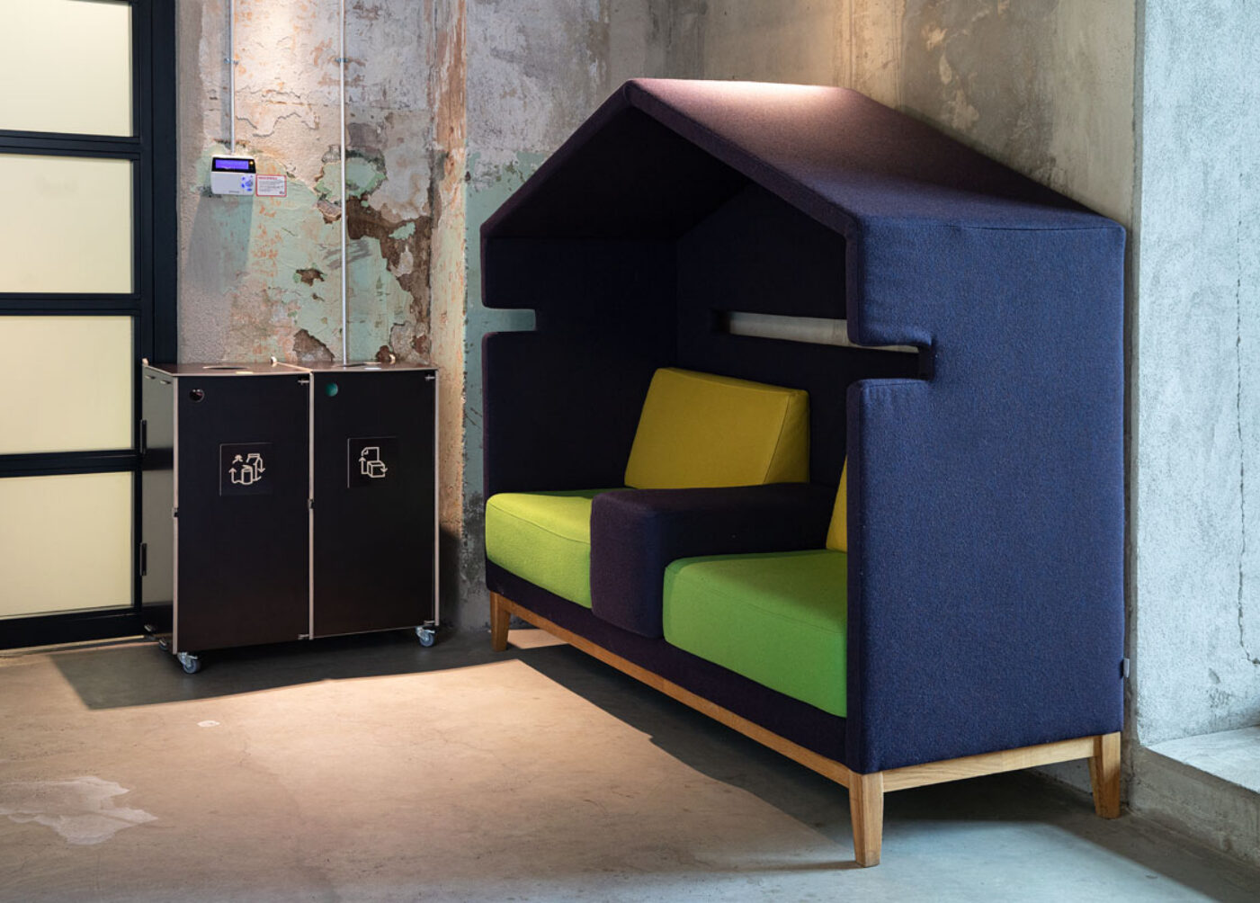 Waste bins for internal office zones placed along corridors to support intuitive waste sorting.