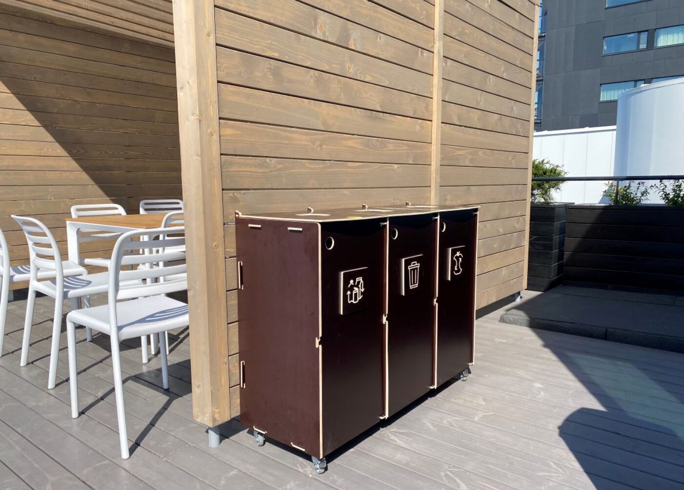 Eco-friendly recycling bins designed for responsible waste sorting.