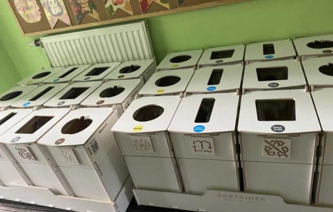 Recycling bins and waste sorting stations in kindergarten high traffic areas, helping children learn proper waste separation.