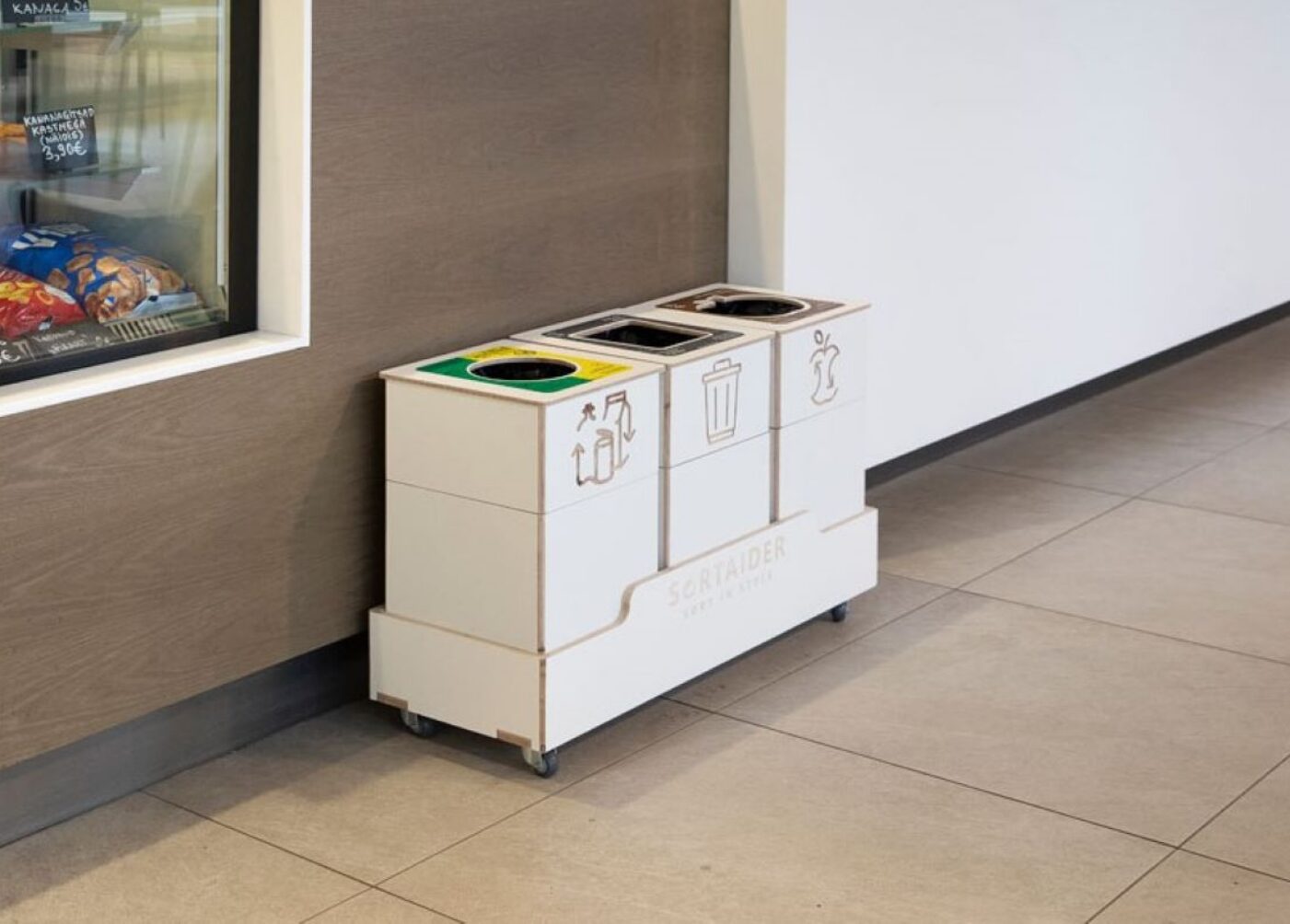 Sortaider multi-compartment recycling bins installed at office for plastic, paper, packaging, and general waste.
